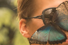 Butterfly sitting on Ombraz teton sunglasses without arms TETON_CHARCOAL_GREY