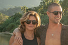 VIALE_TORTOISE_GREY Couple smiling wearing Ombraz viale armless sunglasses with strap